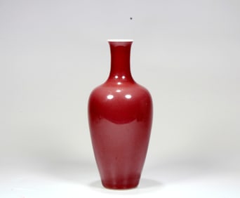 A RED GLAZED GUANYIN VASE
