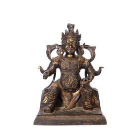 A GILT-BRONZE FIGURE OF WEALTH DEITY