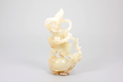 A HETIAN JADE IMMORTAL ORNAMENT