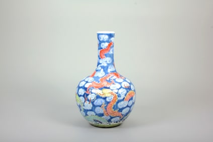 A BLUE-GROUND FAMILLE-ROSE 'CLOUD AND DRAGON' GLOBULAR VASE