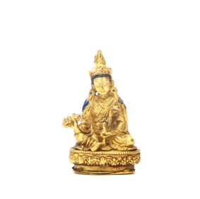 A GILT-BRONZE FIGURE OF BUDDHA