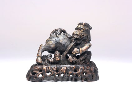 A BRONZE PAPER WEIGHT