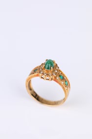 An 18k Gold Emerald and Diamond Ring