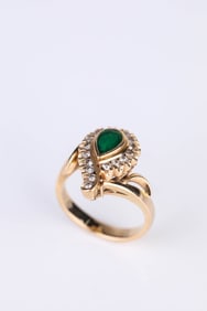 An 18k Gold Emerald and Diamond Ring
