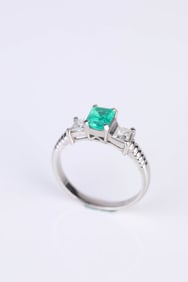 An 18k Gold Emerald and Diamond Ring
