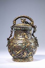 A Gold-and-Silver Inlaid Bronze Gem-Set 'Auspicious Beasts' Covered Vase