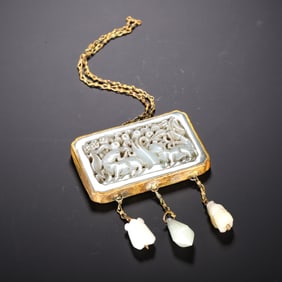 A JADE-WRAPPED-IN-GOLD PENDANT