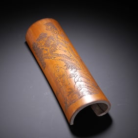 A BAMBOO-CARVED BRUSH REST