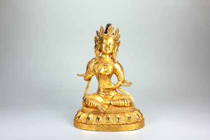 A GILT-BRONZE FIGURE OF TARA