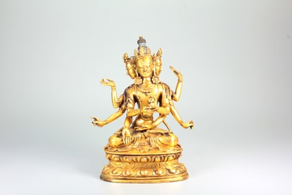 A GILT-BRONZE FIGURE OF USHNISHAVIJAYA BUDDHA MOTHER WITH THREE FACES AND EIGHT ARMS