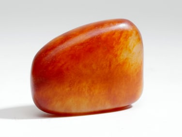 A RAW HETIAN JADE STONE WITH SKIN