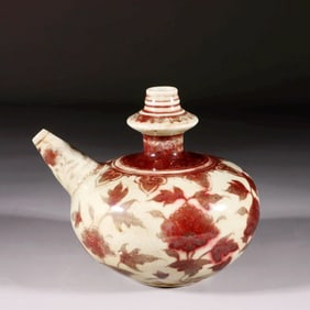 A YUAN DYNASTY UNDERGLAZE-RED KUNDIKA WITH FLORAL PATTERNS