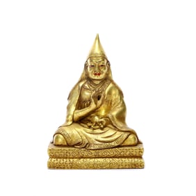 A GILT-BRONZE FIGURE OF TSONGKHAPA