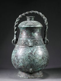 A BRONZE YOU (RITUAL VESSEL) WITH ROPE PATTERNS AND HANDLED BEAM