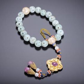 A JADEITE EIGHTEEN-SEED HANDSTRING