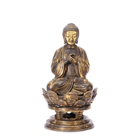 A GILT-BRONZE FIGURE OF VAIROCANA BUDDHA