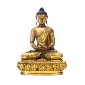 A GILT-BRONZE FIGURE OF BUDDHA