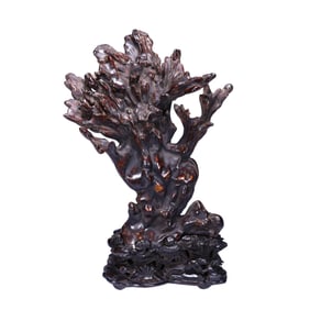 A HUANGHUALI WOOD ORNAMENT