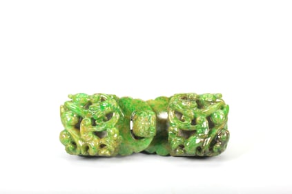 A JADEITE BUCKLE CARVED WITH DRAGON PATTERNS