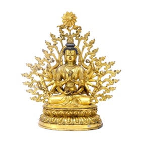 A GILT-BRONZE FIGURE OF THOUSAND-ARMED GUANYIN