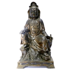 A BRONZE FIGURE OF GUANYIN