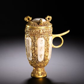 A GILT-BRONZE JADE-INLAID CUP