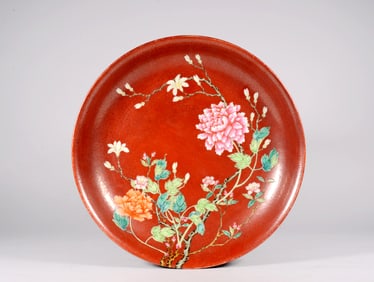 A CORAL-RED-GROUND FAMILLE ROSE FLORAL DISH