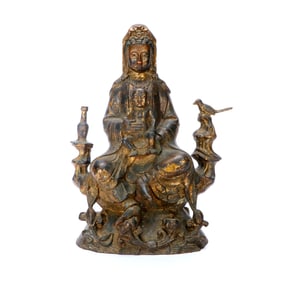 A GILT-BRONZE FIGURE OF GUANYIN BESTOWING CHILDREN