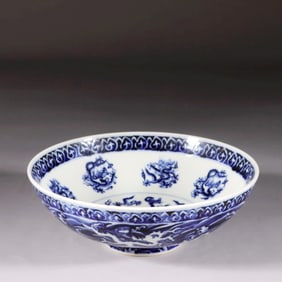A BLUE-AND-WHITE BOWL WITH DRAGON PATTERNS