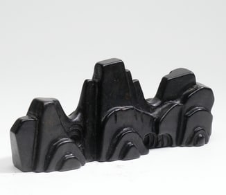 A ROSEWOOD BRUSH REST MOUNTAIN