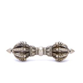 A SILVER VAJRA WITH CROSS PATTERN