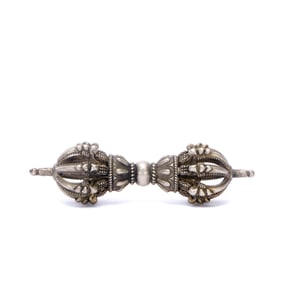 A SILVER VAJRA WITH CROSS PATTERN