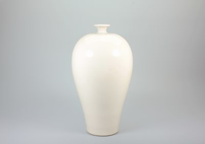 A DING KILN WHITE-GLAZED PLUM VASE