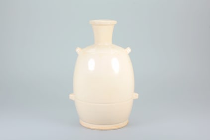 A DING KILN WHITE-GLAZED VASE WITH FOUR HANDLES