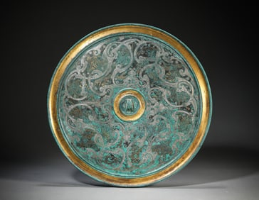 A Gold-and-Silver Inlaid Bronze 'Auspicious Beasts' Mirror