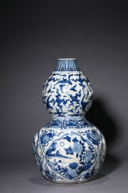 A Blue and White 'Eight Buddhist Emblems, Flowers, and Birds' Vase