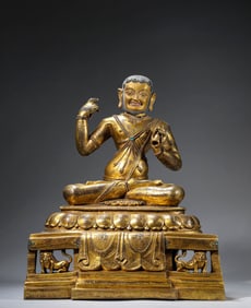 A Tibetan Tashilhunpo-Style Figure of a Mahasiddha