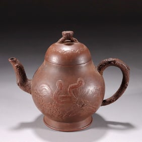 A RELIEF-CARVED PHOENIX ZISHA TEAPOT