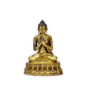 A GILT-BRONZE GUANYIN FIGURE