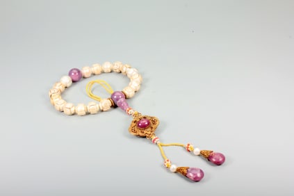 A PEARL CARVED LONGEVITY EIGHTEEN-BEAD BRACELET