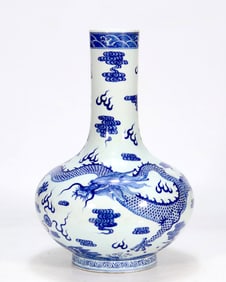 A BLUE AND WHITE FLATTENED GLOBULAR VASE WITH CLOUD AND DRAGON PATTERN