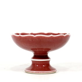 A RED INCENSE HOLDER