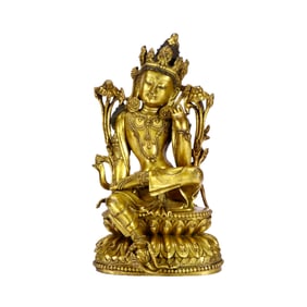A GILT-BRONZE GUANYIN FIGURE