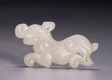 A SMALL WHITE JADE TIGER