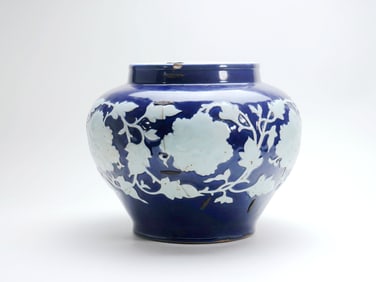 A YUAN BLUE-GLAZED INCISED WHITE PEONY JAR (RIVETED)