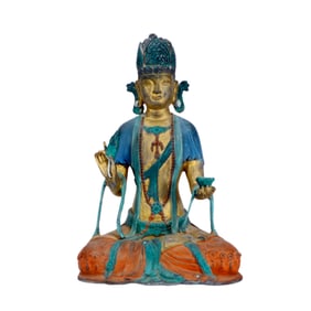 A GILT-BRONZE POLYCHROME GUANYIN FIGURE
