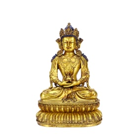 A GILT-BRONZE GUANYIN FIGURE