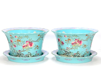 A PAIR OF TURQUOISE-GREEN GLAZED FLOWERPOTS WITH POMEGRANATE PATTERN