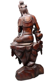 AN ALOESWOOD GUANYIN GILDED FIGURE