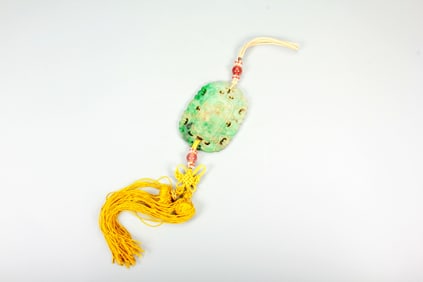 A JADEITE ABSTINENCE PENDANT